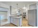 Well-lit kitchen with granite countertops, stainless steel appliances, and wooden floors at 4729 Lang Ridge Dr, North Charleston, SC 29405