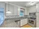 Spacious kitchen boasting granite countertops and stainless steel appliances, ready for cooking at 4729 Lang Ridge Dr, North Charleston, SC 29405
