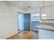 Bright kitchen featuring granite countertops, mosaic backsplash, beadboard, and a stylish blue Dutch door at 4729 Lang Ridge Dr, North Charleston, SC 29405