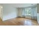 Bright living room with hardwood floors, a large window, and neutral wall paint at 4729 Lang Ridge Dr, North Charleston, SC 29405