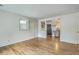 Open-concept living room featuring hardwood floors and seamless transition to the kitchen at 4729 Lang Ridge Dr, North Charleston, SC 29405