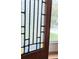 Close-up of a window with decorative glass with a view of greenery outside at 4729 Lang Ridge Dr, North Charleston, SC 29405