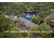 Aerial view of townhomes surrounded by lush, live oak and palmetto trees at 491 Sea Cloud Cir, Edisto Island, SC 29438
