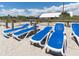 Comfortable beach lounge chairs offering relaxation by the sea, with beachfront homes in the background at 491 Sea Cloud Cir, Edisto Island, SC 29438