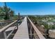 Cabana boardwalk to the beach with showers surrounded by lush landscaping and ocean views at 491 Sea Cloud Cir, Edisto Island, SC 29438
