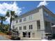 Exterior of golf shop with golf carts and nearby restaurant with parking, set against a blue sky backdrop at 491 Sea Cloud Cir, Edisto Island, SC 29438