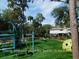 Community playground featuring modern play equipment, set against a backdrop of lush trees and landscaping at 491 Sea Cloud Cir, Edisto Island, SC 29438