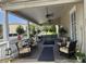 Charming outdoor porch with ample seating and ceiling fans at 491 Sea Cloud Cir, Edisto Island, SC 29438