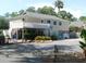 Spacious two-story recreation building surrounded by trees offering cafe, exercise and pool areas at 491 Sea Cloud Cir, Edisto Island, SC 29438