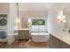 Bright bathroom featuring a freestanding tub, double vanity, and natural light at 499 Lackland Ct, Mount Pleasant, SC 29464
