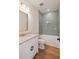 Charming bathroom showcasing a tub with tile surround, marble countertop, and stylish gold fixtures at 499 Lackland Ct, Mount Pleasant, SC 29464