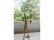 Close-up of a gold bathtub faucet next to a window with green leafy tree views at 499 Lackland Ct, Mount Pleasant, SC 29464
