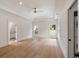 Bright bedroom with a tray ceiling, ceiling fan, hardwood floors, and views from two large windows at 499 Lackland Ct, Mount Pleasant, SC 29464