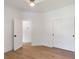 Spacious bedroom featuring wood floors, white walls, and two closet doors at 499 Lackland Ct, Mount Pleasant, SC 29464
