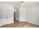 Bedroom with a ceiling fan, hardwood floors, white walls, and two doors at 499 Lackland Ct, Mount Pleasant, SC 29464