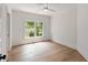 Bedroom with natural light, hardwood flooring, white walls, and a ceiling fan at 499 Lackland Ct, Mount Pleasant, SC 29464