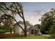 Exterior view of the house featuring a deck, screened-in porch, and well-maintained lawn at 499 Lackland Ct, Mount Pleasant, SC 29464