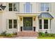 Stunning entrance with red brick steps, potted flowers, and a sophisticated door design with sidelight windows at 499 Lackland Ct, Mount Pleasant, SC 29464