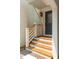 Inviting front porch with wooden steps and white railing and a lantern at 499 Lackland Ct, Mount Pleasant, SC 29464