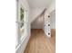 Bright hallway featuring wood floors, a large window, white walls, and an open door at 499 Lackland Ct, Mount Pleasant, SC 29464