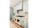 Kitchen with custom cabinets, white marble backsplash, and a professional gas range at 499 Lackland Ct, Mount Pleasant, SC 29464