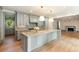 Gourmet kitchen featuring an island with seating, pendant lighting, and professional appliances at 499 Lackland Ct, Mount Pleasant, SC 29464