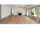 Inviting living room with hardwood floors, a modern fireplace, and stylish wall sconces at 499 Lackland Ct, Mount Pleasant, SC 29464