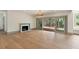 Open living room with fireplace, sliding glass doors and hardwood floors at 499 Lackland Ct, Mount Pleasant, SC 29464