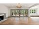 Bright living room featuring a fireplace, hardwood floors, and sliding glass doors to the patio at 499 Lackland Ct, Mount Pleasant, SC 29464