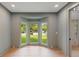 Bright living room with a bay window overlooking a green yard, light gray walls, and elegant hardwood flooring at 499 Lackland Ct, Mount Pleasant, SC 29464