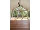 Inviting screened-in porch with ceiling fan and views of the lush backyard at 499 Lackland Ct, Mount Pleasant, SC 29464