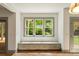 Charming window seat with storage drawers beneath a bright window looking out on the trees at 499 Lackland Ct, Mount Pleasant, SC 29464