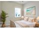 Comfortable bedroom with a decorative headboard, bright natural light, and stylish decor at 505 Eastern Isle Ave, Summerville, SC 29486