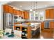 Modern kitchen featuring stainless steel appliances, granite countertops, and a central island at 505 Eastern Isle Ave, Summerville, SC 29486