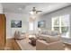Bright living room featuring neutral furnishings, a ceiling fan, and plenty of natural light at 505 Eastern Isle Ave, Summerville, SC 29486