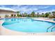 Large community pool with plenty of lounge chairs and umbrellas for shade at 505 Eastern Isle Ave, Summerville, SC 29486