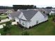 Charming house featuring a well-manicured lawn and driveway, as seen from above at 516 Tidewater Chase Ln, Summerville, SC 29486