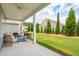 Relaxing back patio with ample seating space overlooking the beautifully landscaped backyard at 516 Tidewater Chase Ln, Summerville, SC 29486