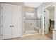This bathroom features a glass-enclosed shower with a built-in bench and tile surround at 516 Tidewater Chase Ln, Summerville, SC 29486