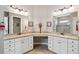 Well-lit bathroom featuring granite countertops, dual sinks and mirrors, and ceramic tile flooring at 516 Tidewater Chase Ln, Summerville, SC 29486