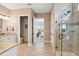 Elegant bathroom features a glass shower, granite vanity, and neutral tile floors at 516 Tidewater Chase Ln, Summerville, SC 29486