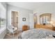 Serene bedroom with rocking chair and ensuite bathroom access at 516 Tidewater Chase Ln, Summerville, SC 29486