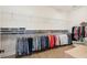 Large walk-in closet with plentiful storage shelves and wood flooring at 516 Tidewater Chase Ln, Summerville, SC 29486