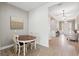 Bright dining area with a round table and views into the foyer and open living spaces at 516 Tidewater Chase Ln, Summerville, SC 29486