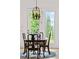 Cozy dining area features a chandelier and access to a backyard patio at 516 Tidewater Chase Ln, Summerville, SC 29486