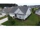Charming single Gathering home featuring a two-car garage and manicured lawn at 516 Tidewater Chase Ln, Summerville, SC 29486
