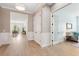 Inviting foyer with wood-look floors leads to dining area and a cozy sitting room; white trim and soft neutral wall colors at 516 Tidewater Chase Ln, Summerville, SC 29486