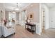 Well-lit foyer showcases stylish decor, complemented by wood-look tile flooring and neutral wall paint at 516 Tidewater Chase Ln, Summerville, SC 29486