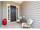 Cozy front porch with seating area perfect for relaxation, enhancing the home's welcoming curb appeal at 516 Tidewater Chase Ln, Summerville, SC 29486