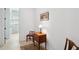 Hallway showcasing a vintage cabinet and chair, leading to a bright room at 516 Tidewater Chase Ln, Summerville, SC 29486